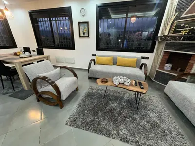 a living room with a couch and chairs and a table at Private Villa, Pool, Gym, Atlas View in Ourika