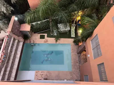 an overhead view of a swimming pool with palm trees at Private Villa, Pool, Gym, Atlas View in Ourika