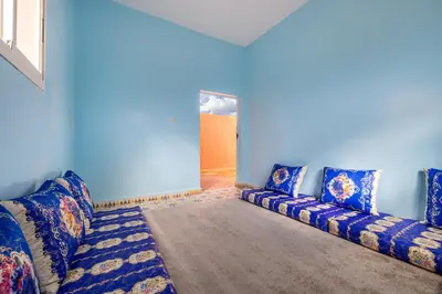 a blue living room with a couch in a room at Private Villa with Pool and Hammam Marrakech in Oulad Akkou
