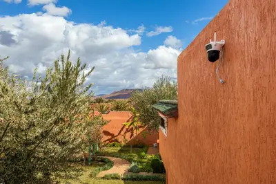 a security camera on the side of a building at Private Villa with Pool and Hammam Marrakech in Oulad Akkou