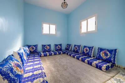 a blue living room with a blue couch at Private Villa with Pool and Hammam Marrakech in Oulad Akkou