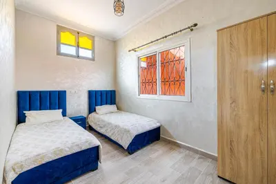 a bedroom with two beds and a window at Private Villa with Pool and Hammam Marrakech in Oulad Akkou