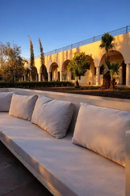 a row of pillows sitting on top of a bench at Dar Laydam in Aït Zat