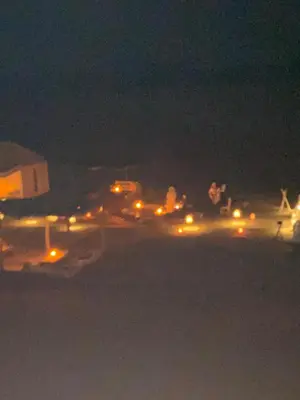 an airport runway at night with lights on at Colorado Desert Camp in El Gouera