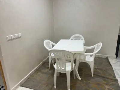 a white table and chairs in a room at Université luxe appart2 in Fès