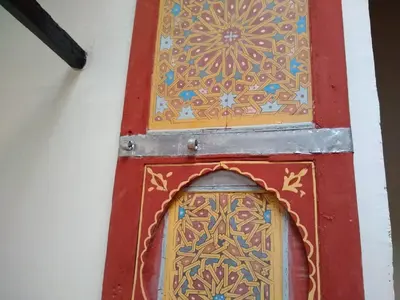 a door with a design on it in a room at chez dar Ayoub in Fès