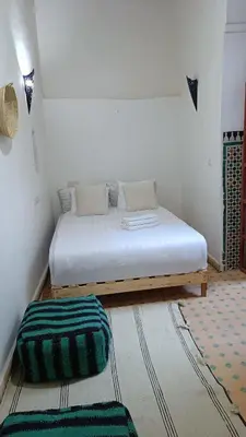 a bedroom with a bed in a room at chez dar Ayoub in Fès