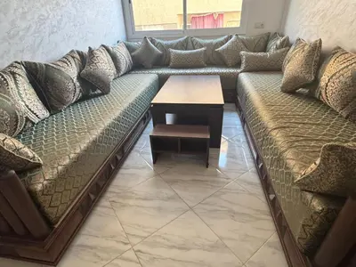 a living room with a couch and a table at Darappart in Fès