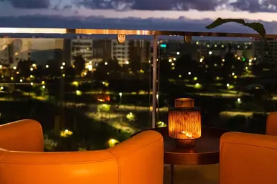a room with a view of a city at night at Luxury Apartment Prestigia Champ Cours Garden View in Fès