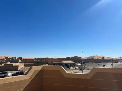 a view of a parking lot from the top of a building at Dream Merzouga Rooms in Merzouga
