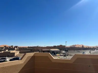 a view of a parking lot from the top of a building at Dream Merzouga Rooms in Merzouga