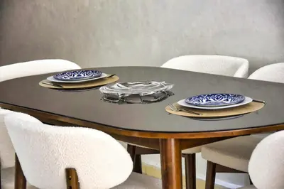 a dining room table with chairs and plates on it at Sunny get away in Agadir, Balcony and View in Oulad Akkou