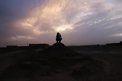 a person sitting on top of a pile of dirt at La Casa De GanGa in Khamliya