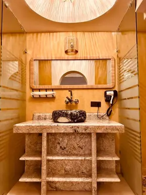 a bathroom with a sink in a trailer at riad tighmart in Merzouga