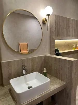 a bathroom with a white sink and a mirror at Modern accommodation with Riad spirit in Hivernage in Oulad Akkou