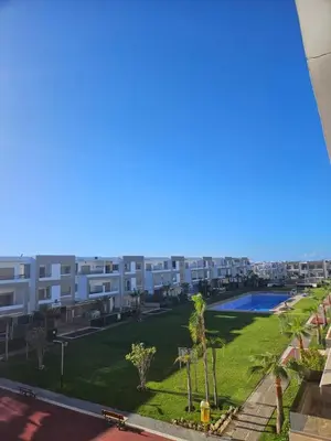 arial view of a large apartment complex with a yard at CONFORT HOMe in Oulad Akkou