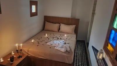 a bedroom with a bed with lights on it at Dar Boueden - lala hadhoum- Guest House in Fès