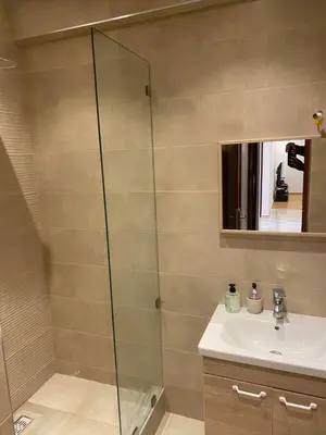 a bathroom with a shower and a sink at Miloche home in Oulad Akkou