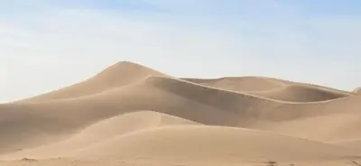 a group of sand dunes in the desert at Desert feet in Mhamid