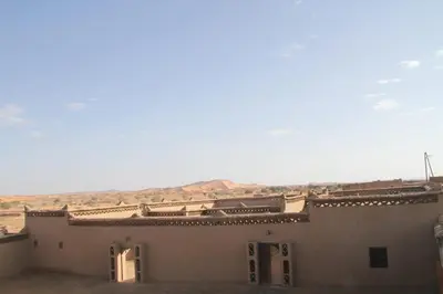 a building in the middle of the desert at Sahara Apartament in Rissani