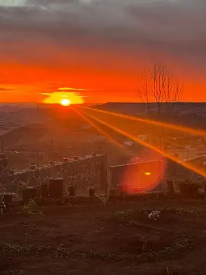 a sunset with the sun setting in the distance at Family Villa with Panoramic View of Infinite Horizon in Ifrane