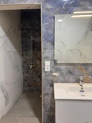a bathroom with a sink and a shower at Family Villa with Panoramic View of Infinite Horizon in Ifrane