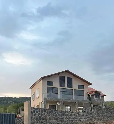 a house sitting on top of a stone wall at Family Villa with Panoramic View of Infinite Horizon in Ifrane