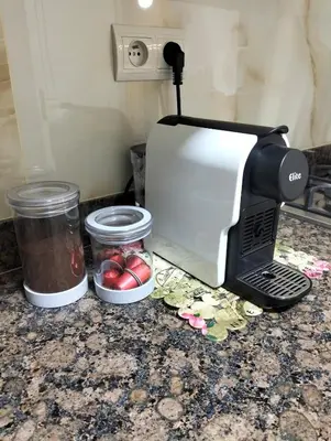 a coffee maker sitting on top of a counter at well-equipped 2 bedroom apartment living room in Tiflet