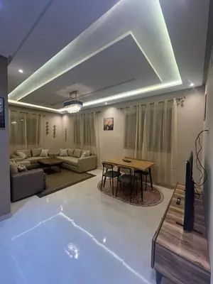 a living room with a table and a couch at NEW Luxury & Equipped Dalia , 2 bedrooms living room in Tiflet