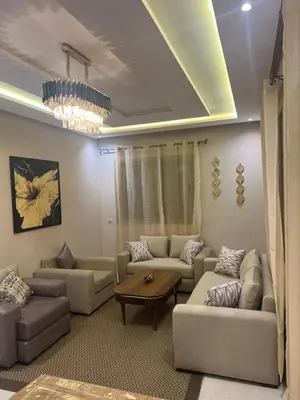 a living room with couches and a coffee table at NEW Luxury & Equipped Dalia , 2 bedrooms living room in Tiflet