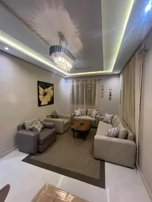 a living room with two couches and a table at NEW Luxury & Equipped Dalia , 2 bedrooms living room in Tiflet
