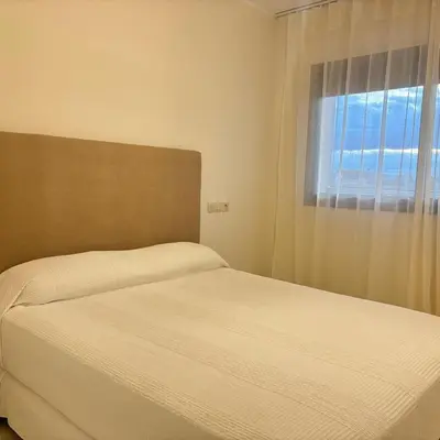 a bedroom with a bed and a window at Warm & Stylish Boho Condo - 6 km to Old Medina in Fès