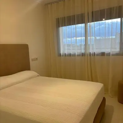 a bedroom with a bed and a window at Warm & Stylish Boho Condo - 6 km to Old Medina in Fès