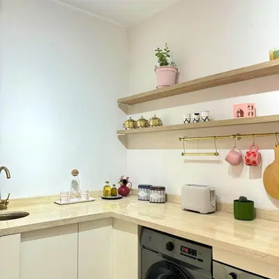 a kitchen with a counter top with a dishwasher at Warm & Stylish Boho Condo - 6 km to Old Medina in Fès