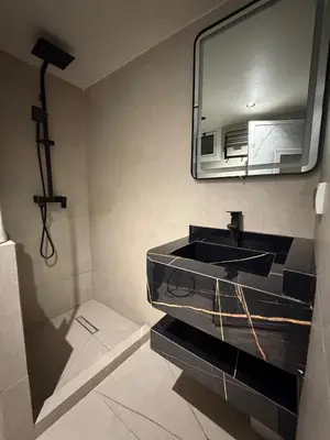 a bathroom with a sink and a mirror at Dunes d or Stay in Er Rachidia