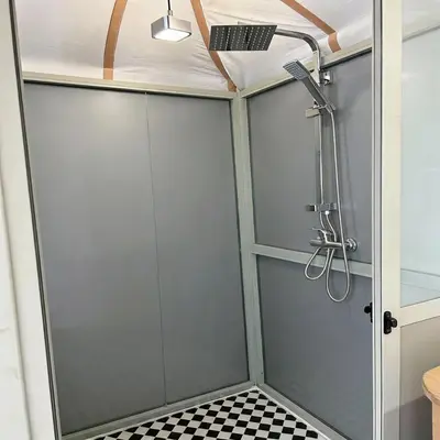 a shower with a glass door and a ceiling at Saba Queen Camp in Khamliya