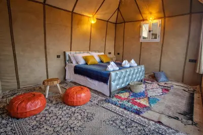 a bedroom with a bed and pumpkins in a room at Chams Luxury Camp in Lac Yasmins