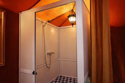a shower with a glass door in a bathroom at Chams Luxury Camp in Lac Yasmins