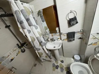 a small bathroom with a sink and a toilet at Lamoulian stay in Fès