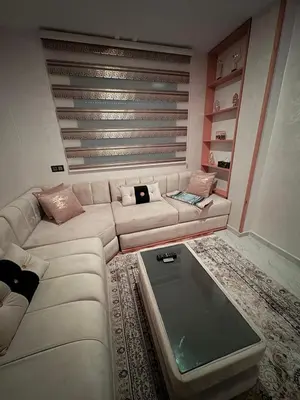 a living room with a couch and a coffee table at Lamoulian stay in Fès