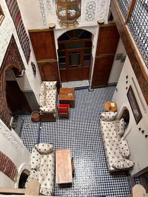 an overhead view of a room with chairs and a table at Riad dar milouda in Fès
