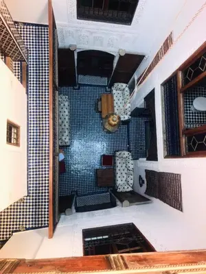 a view of a room with blue tile on the wall at Riad dar milouda in Fès