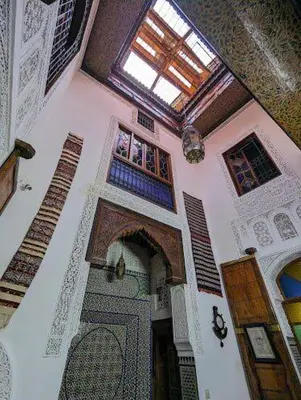 a room with a building with a window and a door at Riad dar milouda in Fès