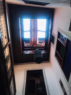 a room with a window in a building at Riad dar milouda in Fès