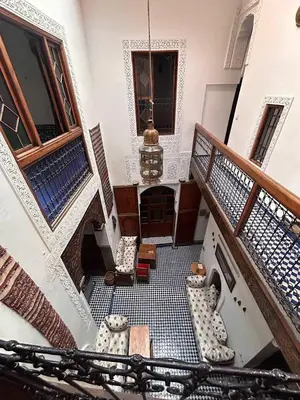 a room with a staircase with vases on the floor at Riad dar milouda in Fès