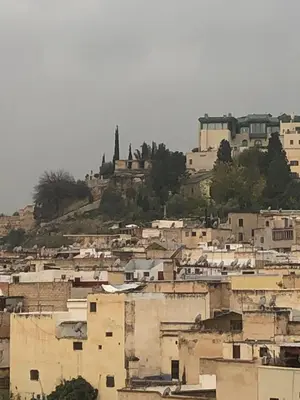 a group of buildings on top of a hill at khamsin home in Oulad Akkou