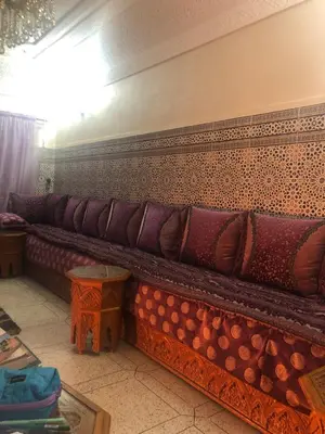 a row of cushions on a couch in a room at khamsin home in Oulad Akkou