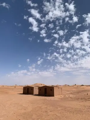 a building in the middle of the desert at Camp Nuyum in Ksiba