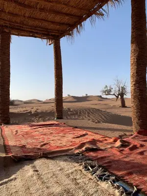 a bed in the middle of the desert at Camp Nuyum in Ksiba