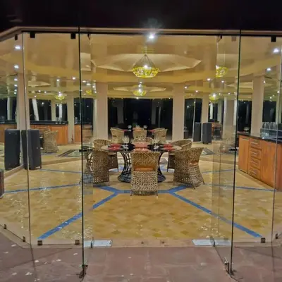 a lobby with a table and chairs in a room at VIilla SOLANA Domaine LAMRAH in Oulad Snaguia